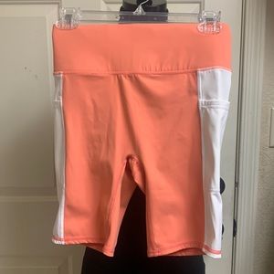 4/FOURLAPS XS Orange and white with side pockets and inside pocket Shorts